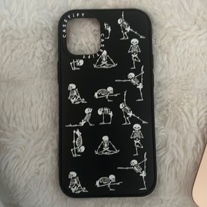 Casetify Black case with skeletons doing yoga positions for iPhone 12 mini